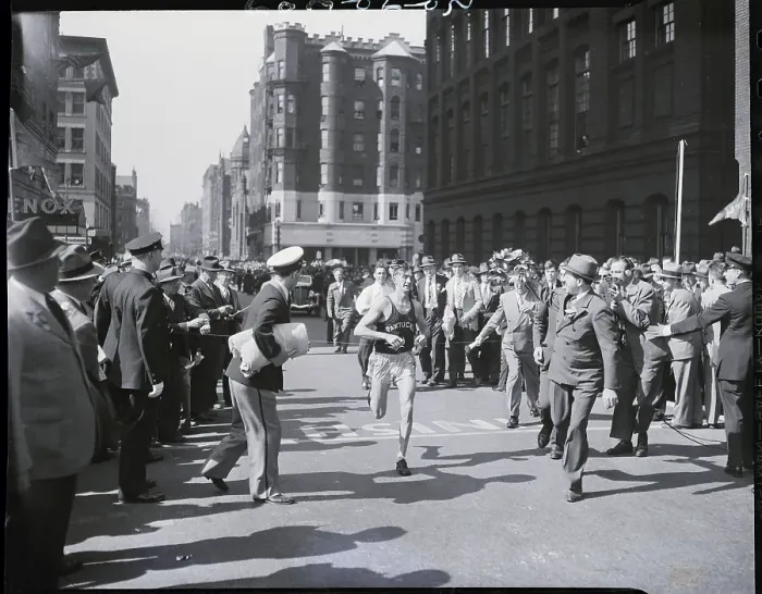 Framed Print : Man Crossing Finish In Marathon