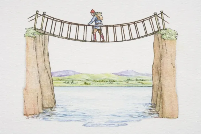 Framed Print : Man crossing rope bridge spanning river, mountain landscape in background Framed Print : Man crossing rope bridge spanning river, mountain landscape in background