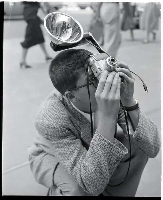 Framed Print : Man Crouches To Snap Photo Framed Print : Man Crouches To Snap Photo