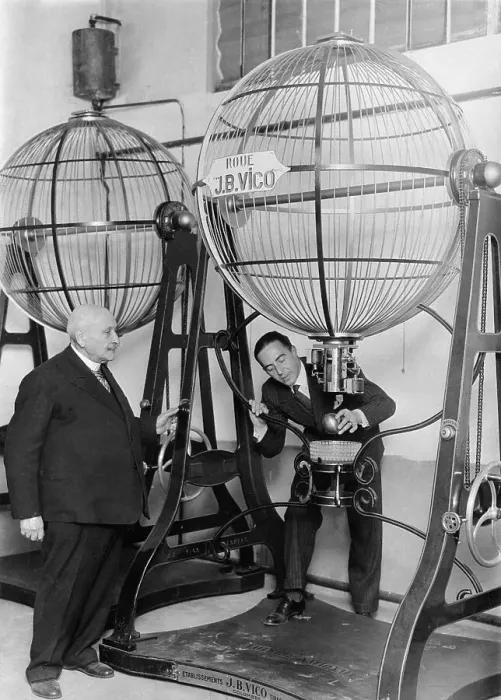 Framed Print : Man Demonstrates Speres Used for Lottery Framed Print : Man Demonstrates Speres Used for Lottery