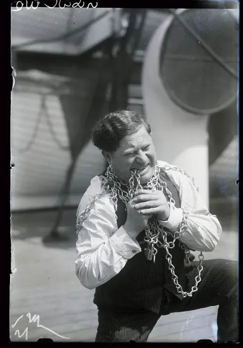 Framed Print : Man Demonstrates Teeth Chain Breaking Framed Print : Man Demonstrates Teeth Chain Breaking