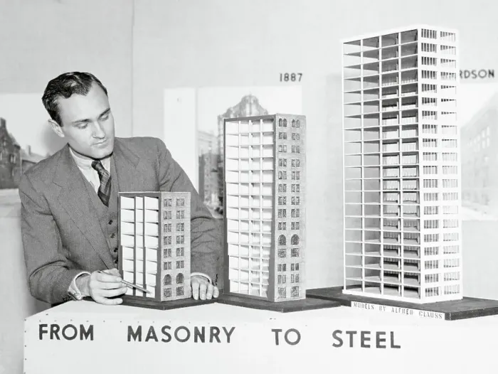 Framed Print : Man Displaying Building Models Framed Print : Man Displaying Building Models