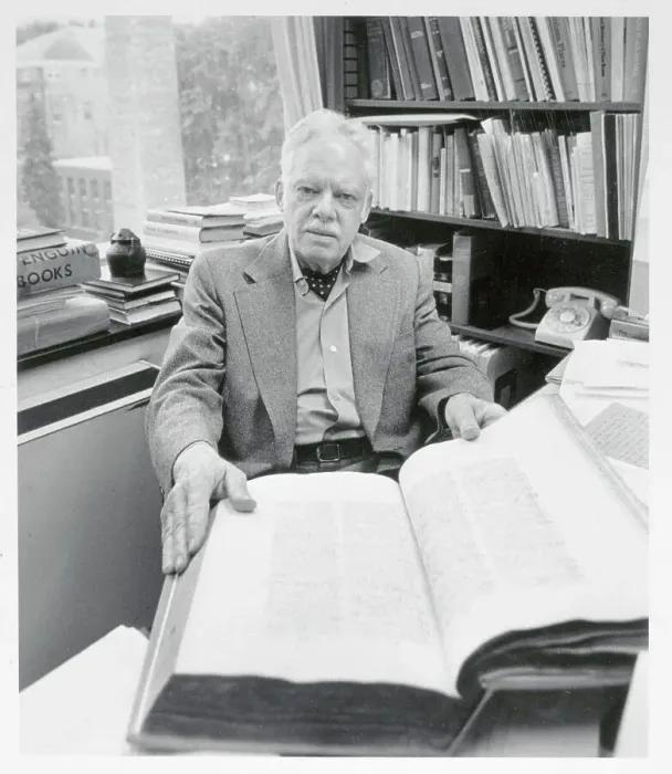 Framed Print : Man Displaying Large Dictionary Framed Print : Man Displaying Large Dictionary