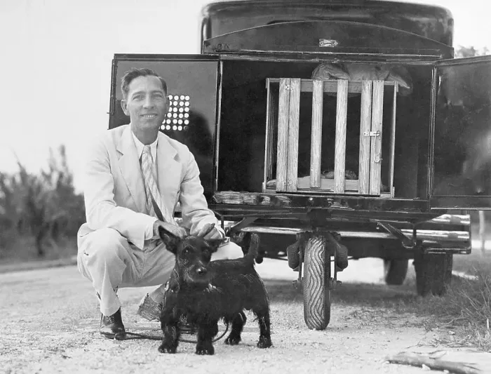 Framed Print : Man and Dog Near Dog Trailer Framed Print : Man and Dog Near Dog Trailer