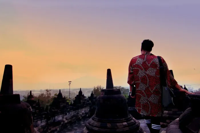 Framed Print : Man in dress overlooking mountains at Borobudur Framed Print : Man in dress overlooking mountains at Borobudur