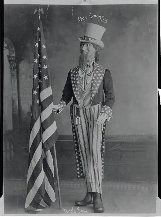 Framed Print : Man Dressed as Uncle Sam Grasping American Flag Framed Print : Man Dressed as Uncle Sam Grasping American Flag