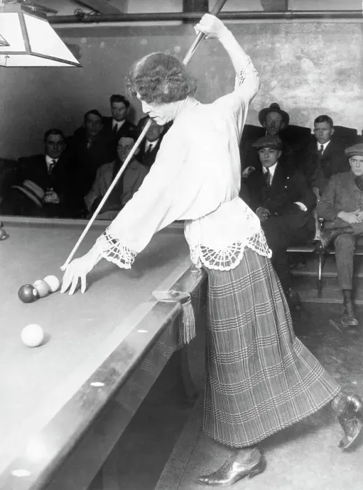 Framed Print : Man dressed as woman aiming cue at pool table Framed Print : Man dressed as woman aiming cue at pool table