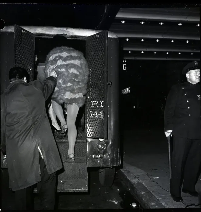 Framed Print : Man Dressed As Woman Being Arrested Framed Print : Man Dressed As Woman Being Arrested