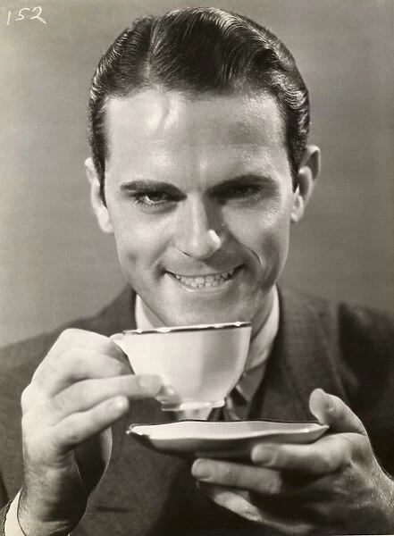 Man drinking cup of coffee