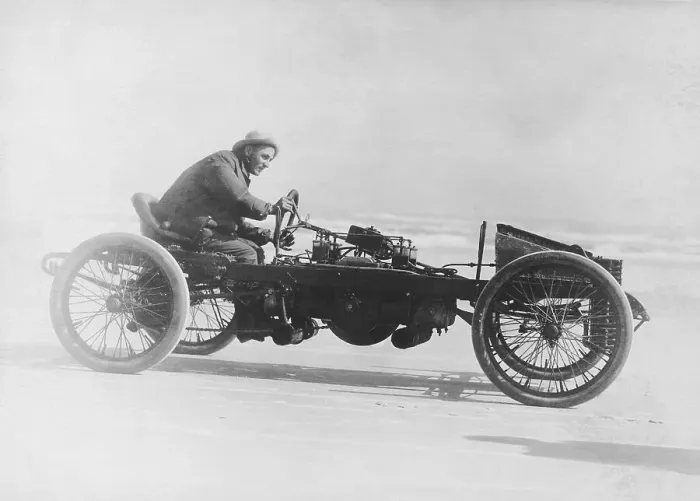 Framed Print : Man driving vintage race car (B&W) Framed Print : Man driving vintage race car (B&W)