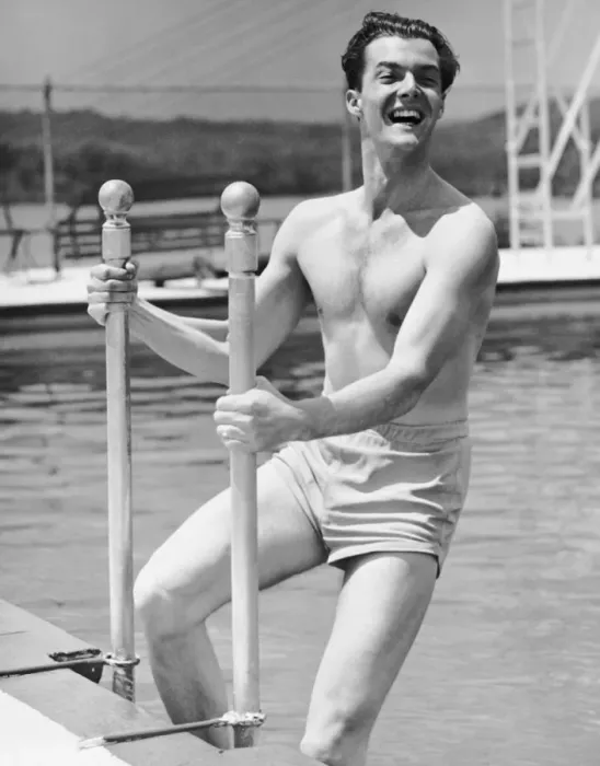 Framed Print : Man entering swimming pool Framed Print : Man entering swimming pool