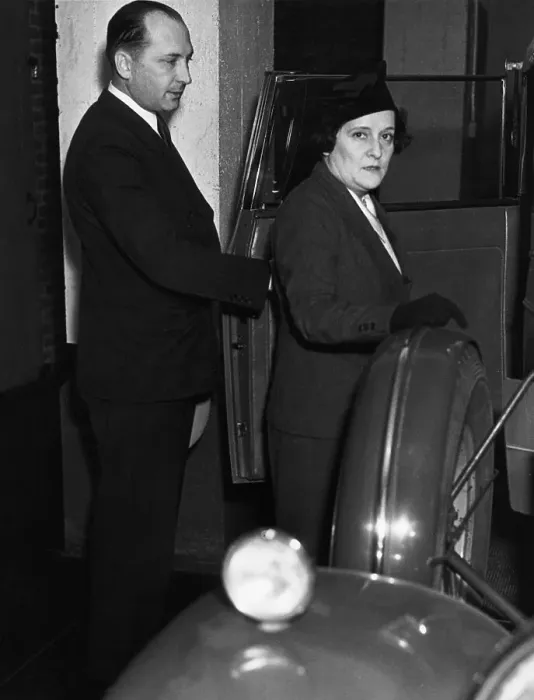 Framed Print : Man Escorting Woman into Car Framed Print : Man Escorting Woman into Car