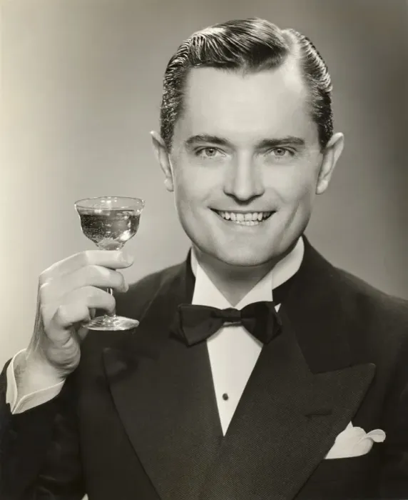 Framed Print : Man in evening clothes raising glass Framed Print : Man in evening clothes raising glass