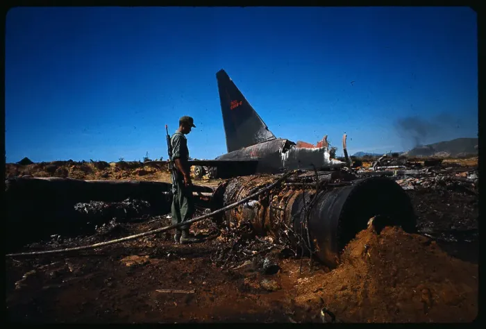 Framed Print : Man Examining Crash Site Framed Print : Man Examining Crash Site