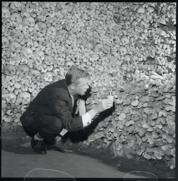 Framed Print : Man Examining Pile of Skeleton Remains Framed Print : Man Examining Pile of Skeleton Remains