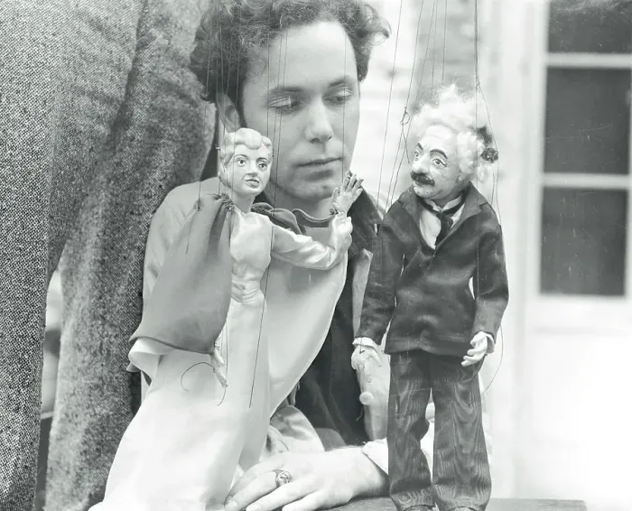 Framed Print : Man with Famous Personality Hand Puppets Framed Print : Man with Famous Personality Hand Puppets
