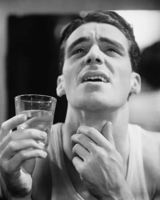 Framed Print : Man gargling, touching throat (B&W) Framed Print : Man gargling, touching throat (B&W)