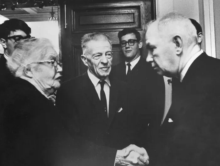 Framed Print : Man Greeting Elderly Couple Framed Print : Man Greeting Elderly Couple
