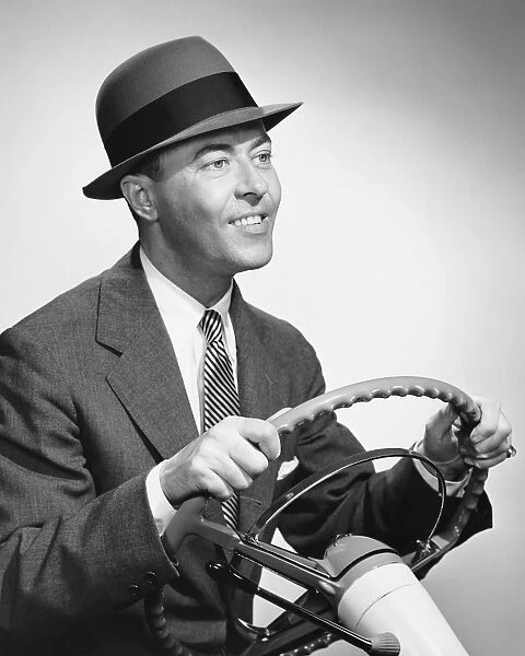 Man gripping steering wheel