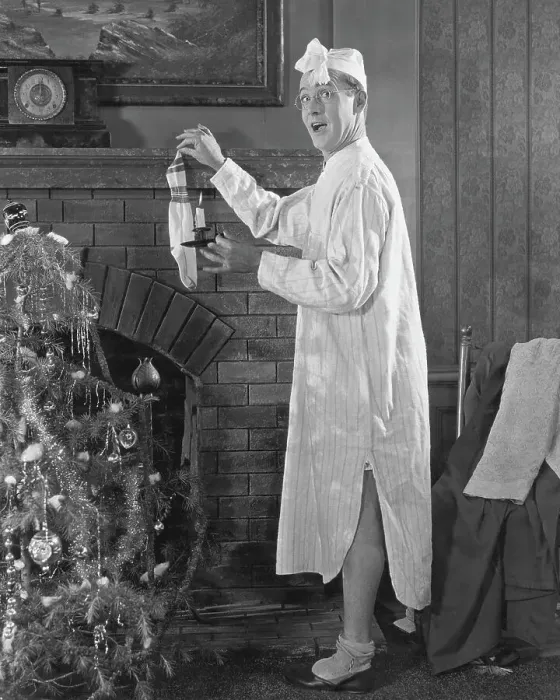 Framed Print : Man Hanging Stocking By Fireplace Framed Print : Man Hanging Stocking By Fireplace