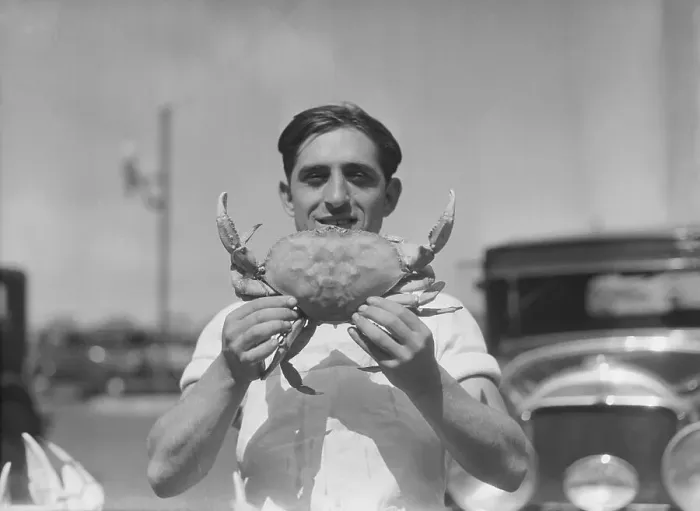 Framed Print : Man Holding Large Crab Framed Print : Man Holding Large Crab