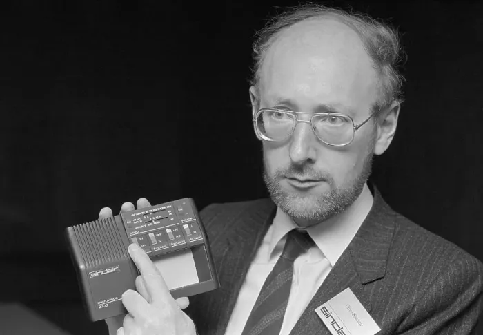  : Man Holding a Pocket Television
