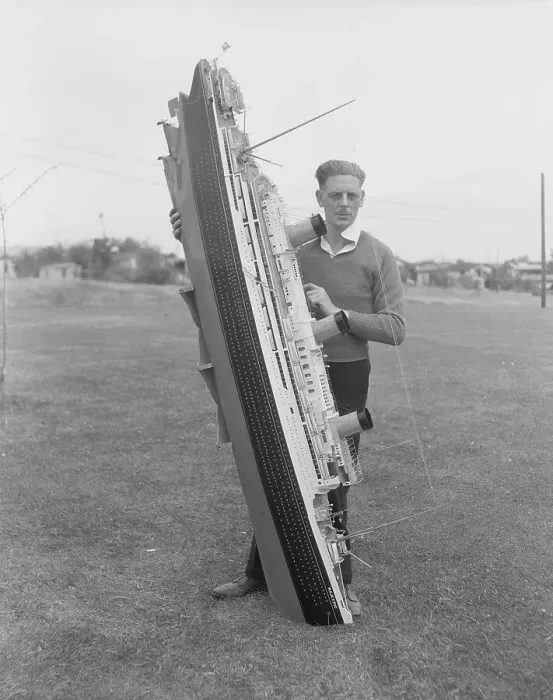Framed Print : Man Holding Ship Model Framed Print : Man Holding Ship Model
