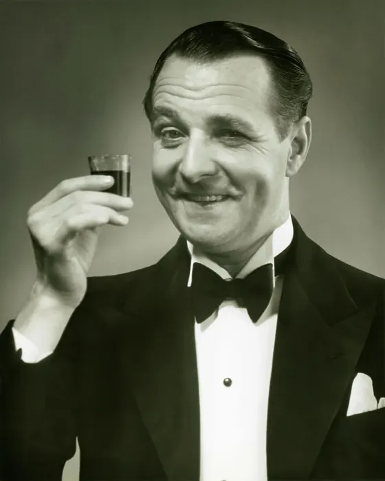 Framed Print : Man holding shot of alcohol Framed Print : Man holding shot of alcohol