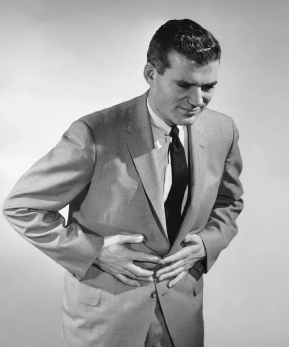 Framed Print : Man holding stomach