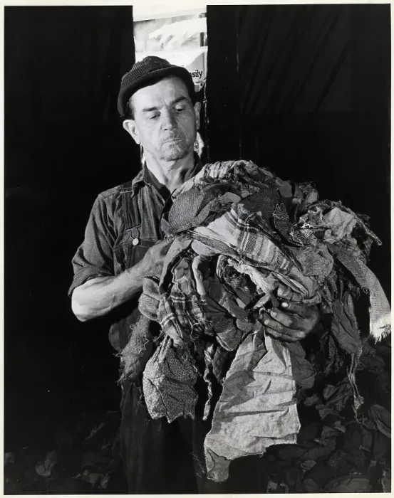Framed Print : Man Holding Torn Fabric Scraps Framed Print : Man Holding Torn Fabric Scraps