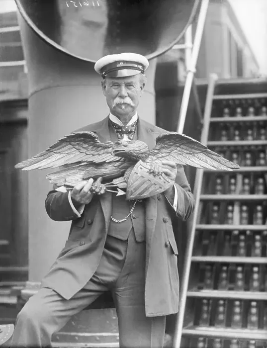 Framed Print : Man Holding Wooden Eagle from America Yacht Framed Print : Man Holding Wooden Eagle from America Yacht