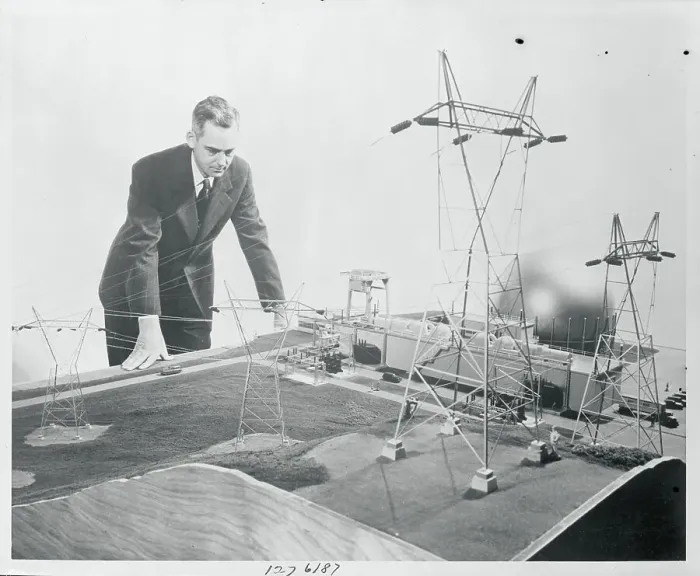 Framed Print : Man Inspecting Model Atomic Plant Framed Print : Man Inspecting Model Atomic Plant