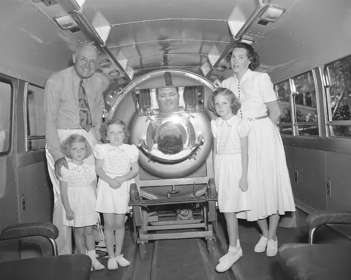 Framed Print : Man in Iron Lung Surrounded by Family Framed Print : Man in Iron Lung Surrounded by Family