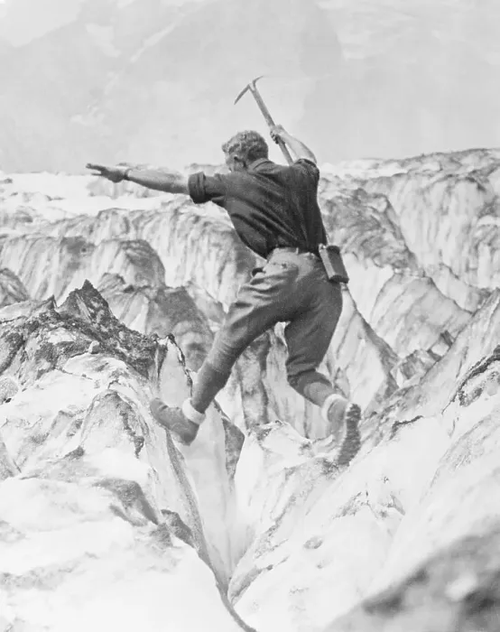 Framed Print : Man Jumping Across Glacier Crevasse Framed Print : Man Jumping Across Glacier Crevasse