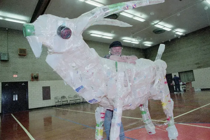 Framed Print : Man Leaning On Sculture; 10-Foot Goat Framed Print : Man Leaning On Sculture; 10-Foot Goat