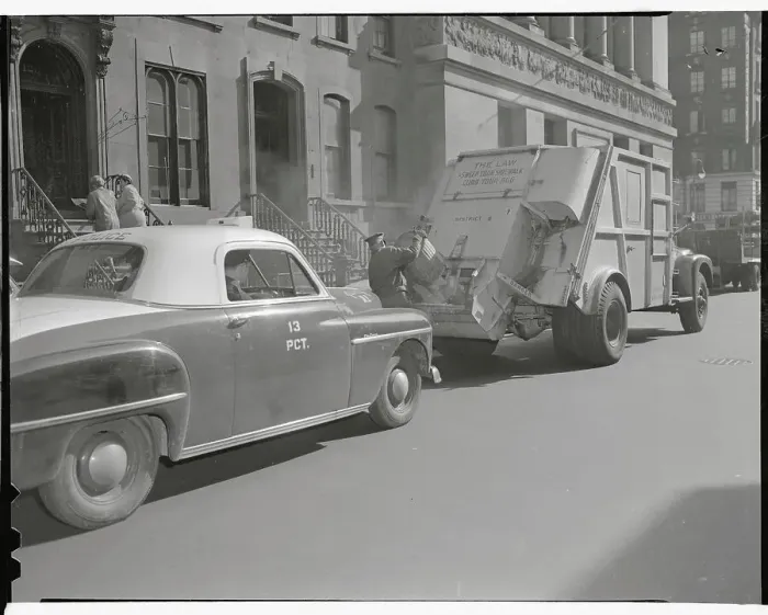 Framed Print : Man Loading Garbage Into Truck Framed Print : Man Loading Garbage Into Truck