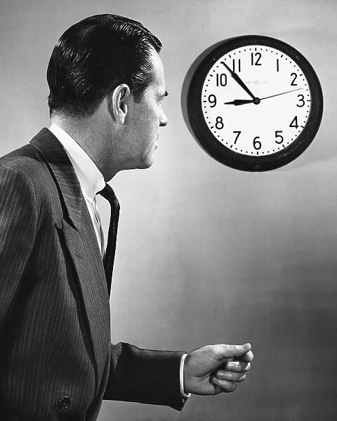 Man looking at clock