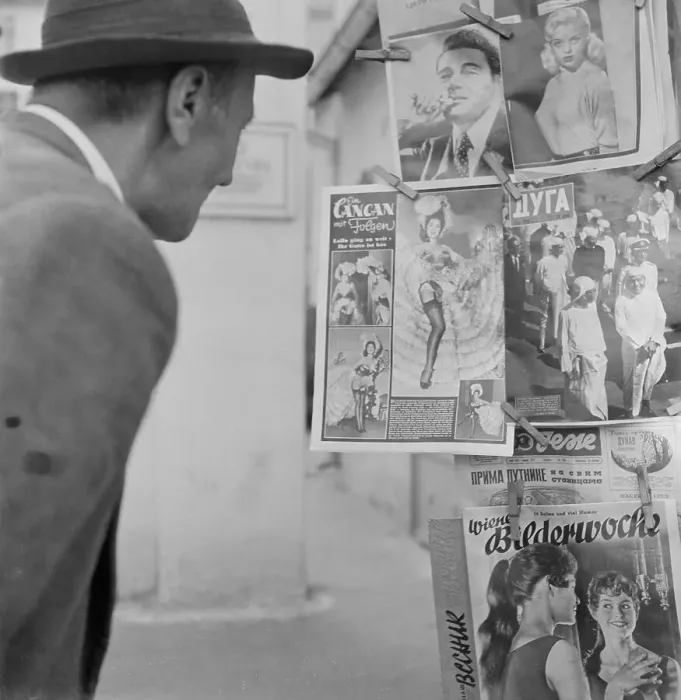Framed Print : Man Looking at Magazine Covers Framed Print : Man Looking at Magazine Covers
