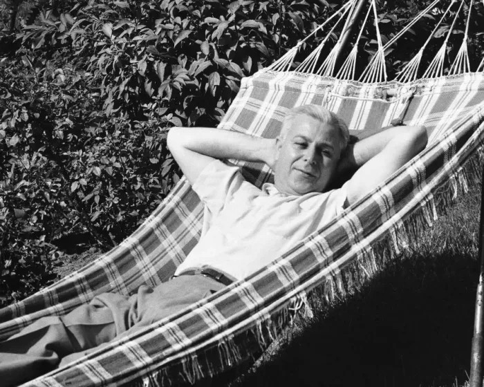 Framed Print : Man lying in hammock