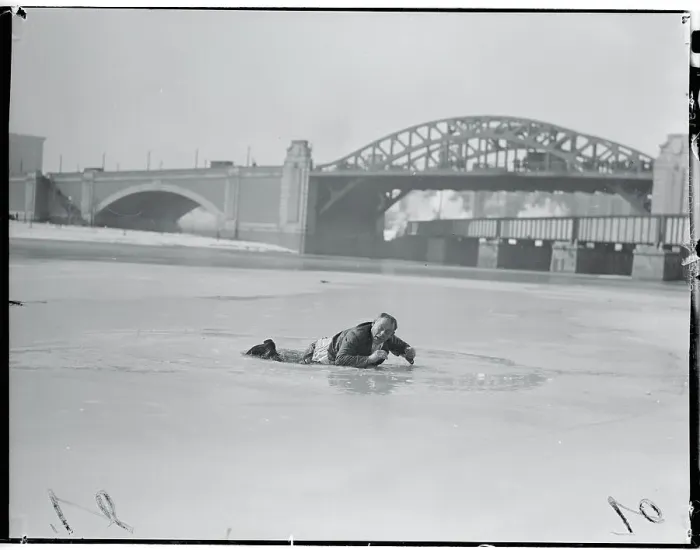 Framed Print : Man Lying on Icy River Framed Print : Man Lying on Icy River