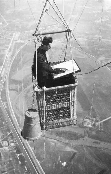 Framed Print : Man Mapping Terrain from Balloon