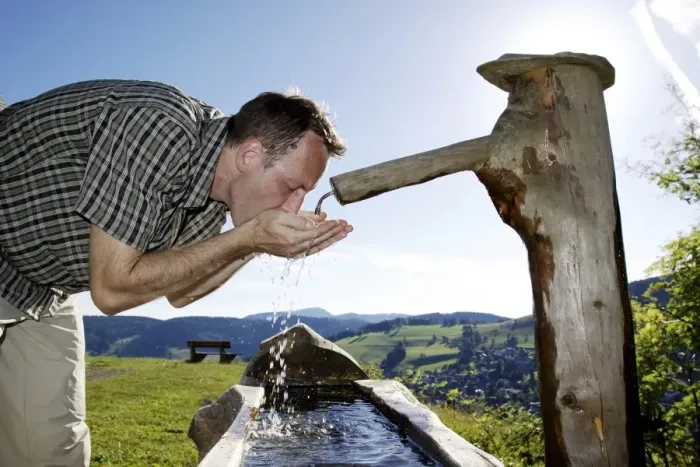 Framed Print : A man in his mid 40 quenches his thirst at a well, Todtnauberg in the Black Forest, Baden-Wuerttemberg, Germany, Europe Framed Print : A man in his mid 40 quenches his thirst at a well, Todtnauberg in the Black Forest, Baden-Wuerttemberg, Germany, Europe