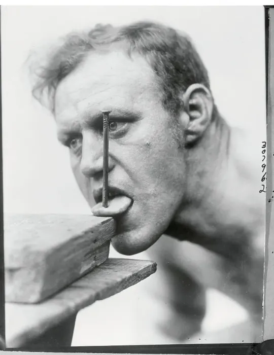 Framed Print : Man With Nail in Tongue