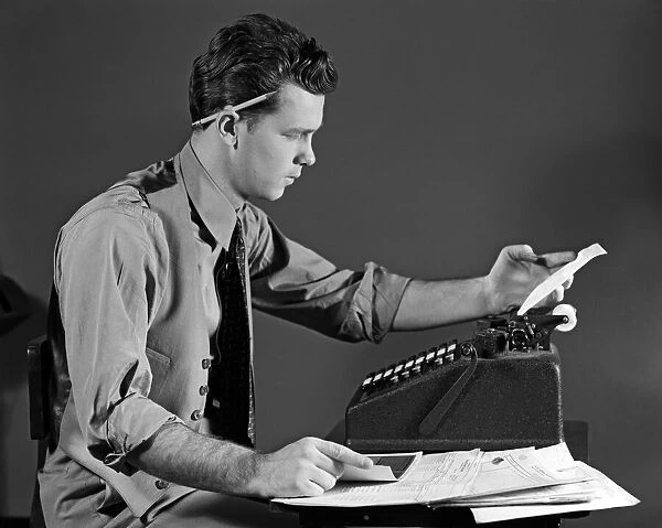 Man In Office At Adding Machine, Looking At Tape