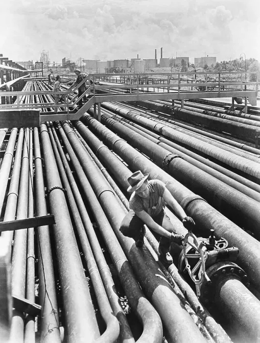 Framed Print : Man Opening Oil Pipeline Valve
