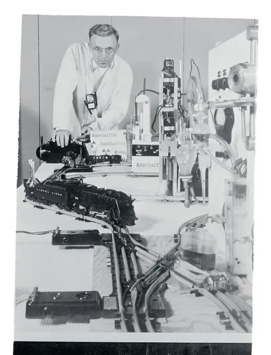 Framed Print : Man Operating a Toy Train Framed Print : Man Operating a Toy Train