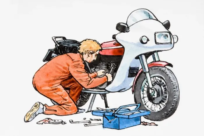 Framed Print : Man in overalls repairing motorbike Framed Print : Man in overalls repairing motorbike