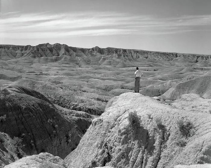 Framed Print : Man Overlooks The Badlands Framed Print : Man Overlooks The Badlands