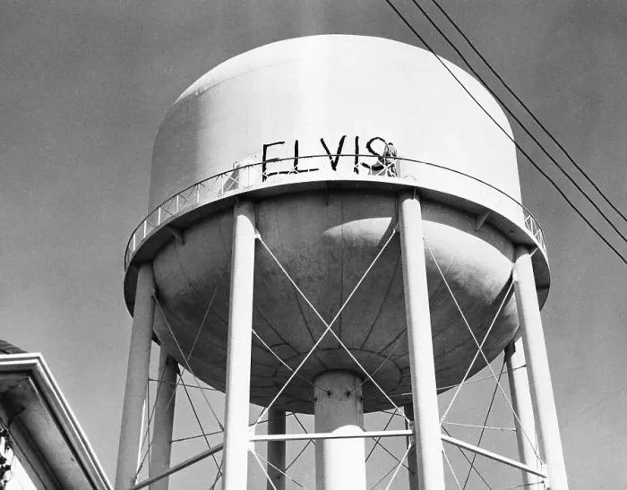 Framed Print : Man Painting Elvis On Water Tower Framed Print : Man Painting Elvis On Water Tower