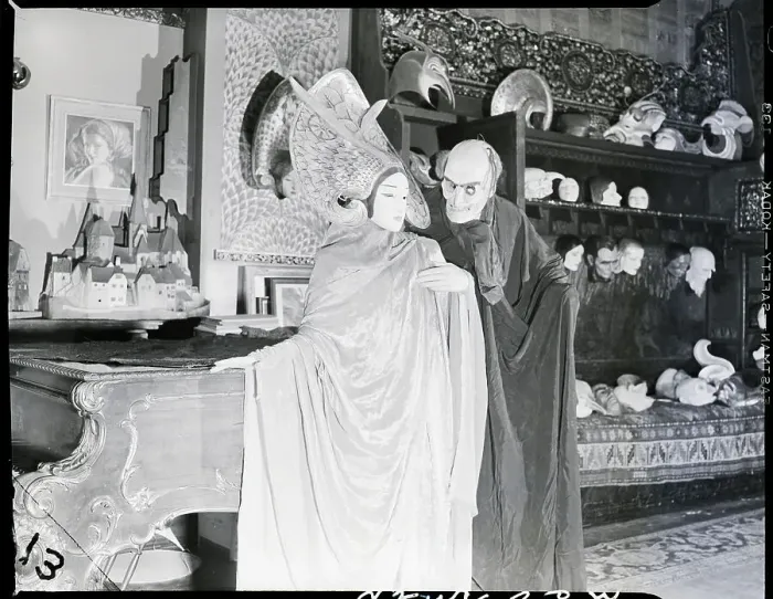Framed Print : Man in Pestilence Mask with Woman as Goddess Framed Print : Man in Pestilence Mask with Woman as Goddess